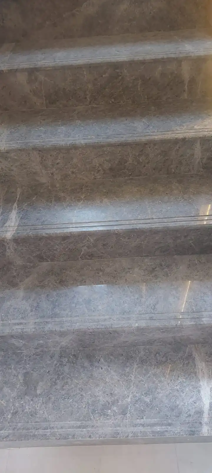 Dull marble floor in a Dubai villa before professional crystallization treatment
